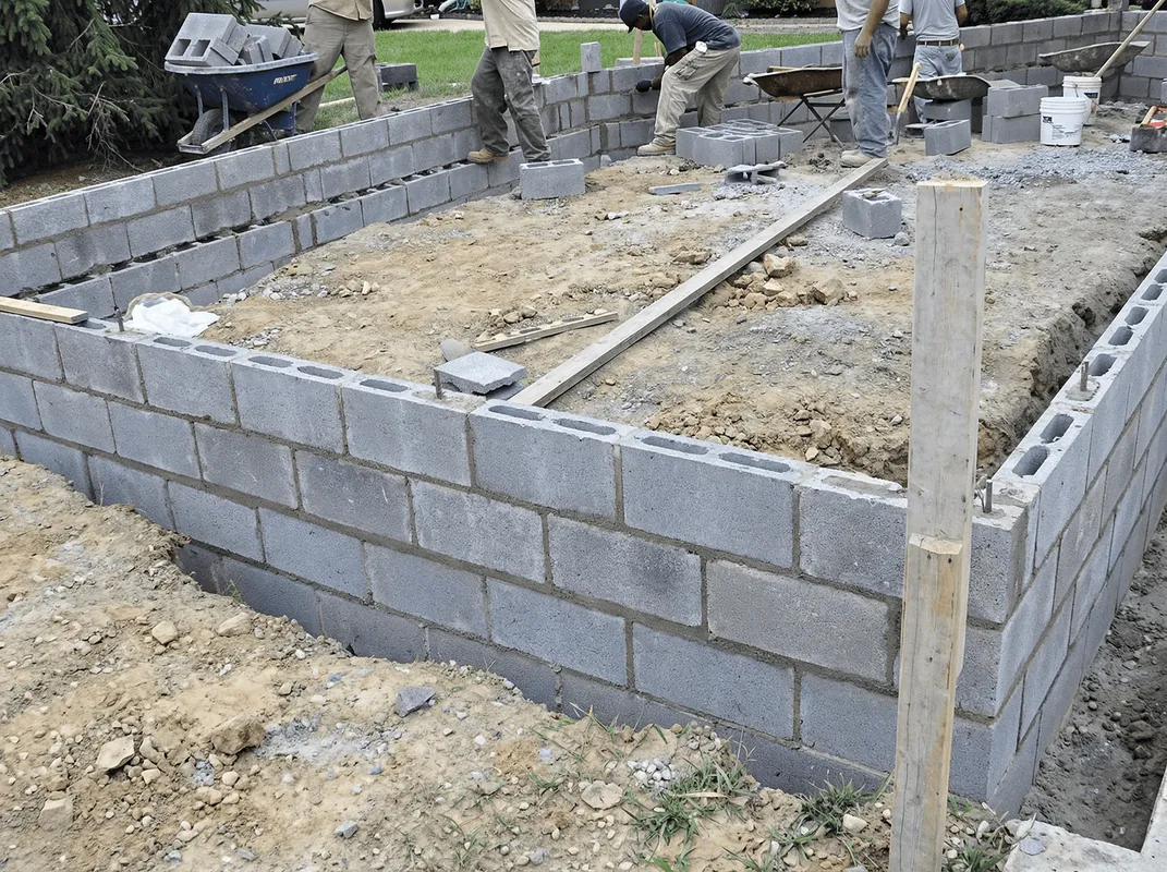 Professionals building a foundation with blocks in Kansas City, KS