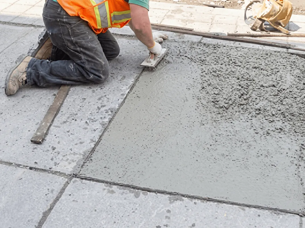 Professional repairing a concrete floor in Kansas City, KS