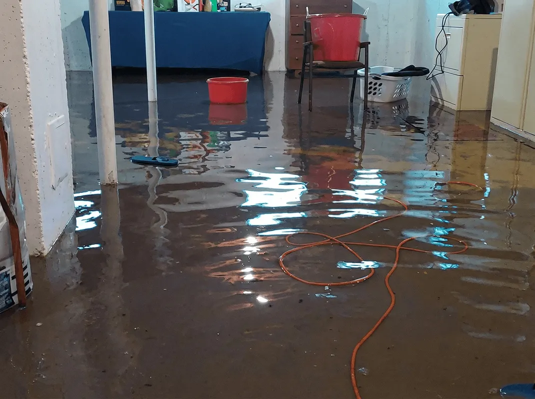 Basement with boiler, cabinets and washing machine completely flooded in Kansas City, KS